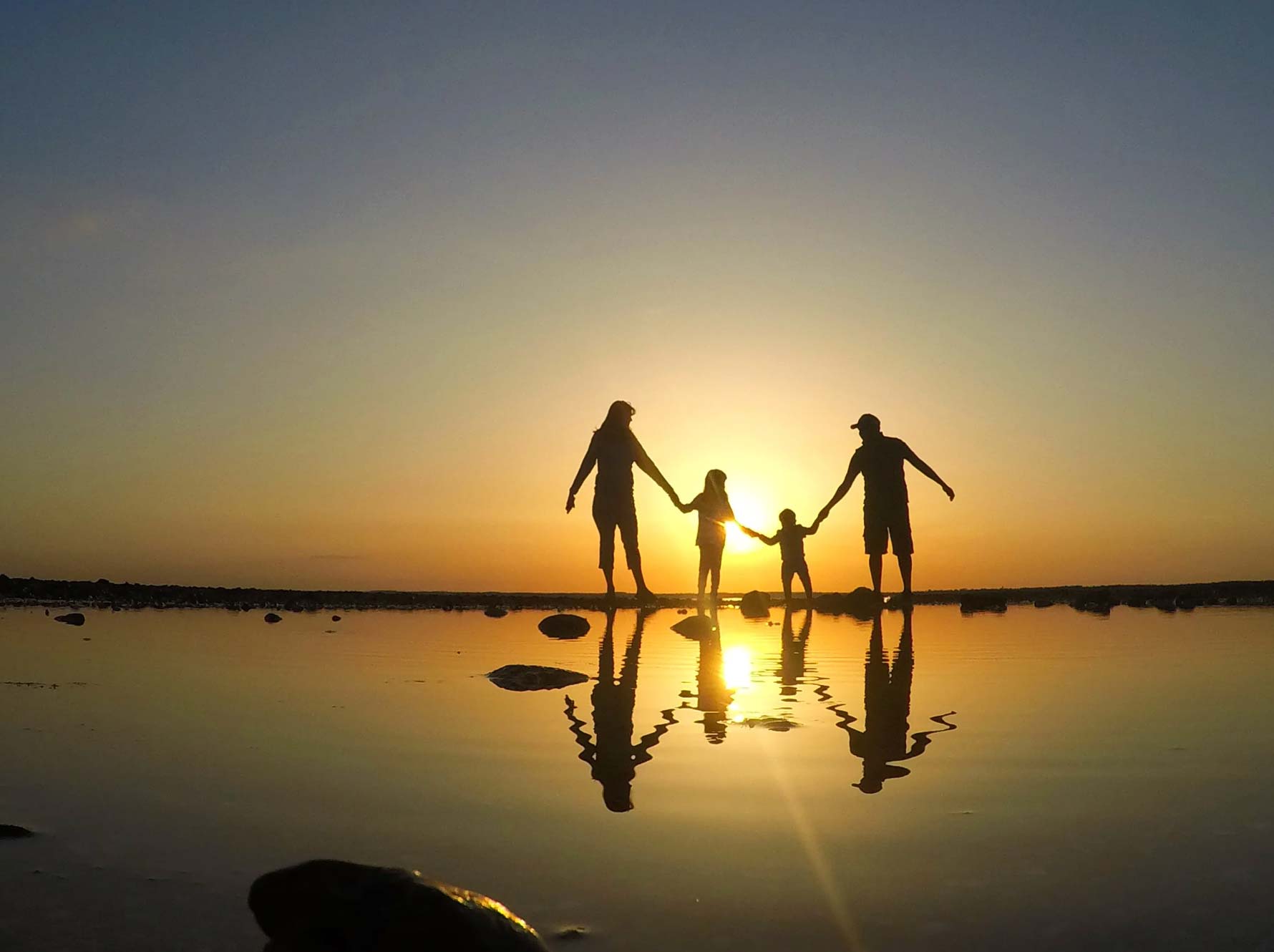Family walking on the beach